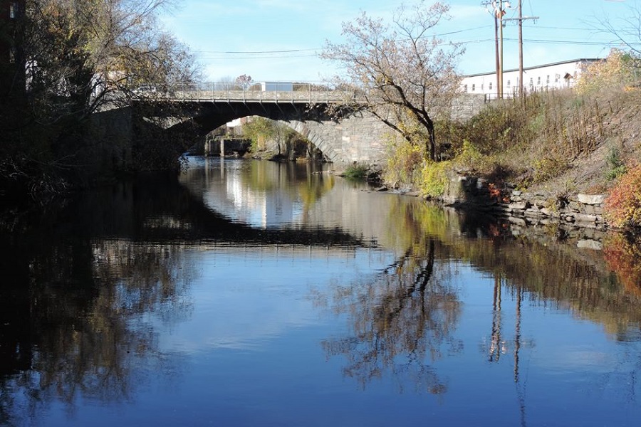 3. Historic stone arch bridge delineates WWP’s 3.4 acre lot. WWP owns the riverbed underlying the Willimantic River.